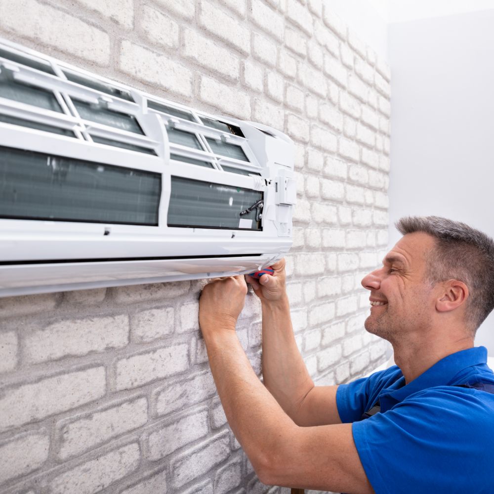 HVAC technician inspecting aging air conditioner before full replacement recommendation