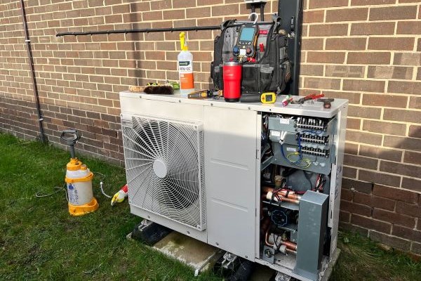 Heat pump system being serviced by Neal HVAC outside a residential property in Georgetown
