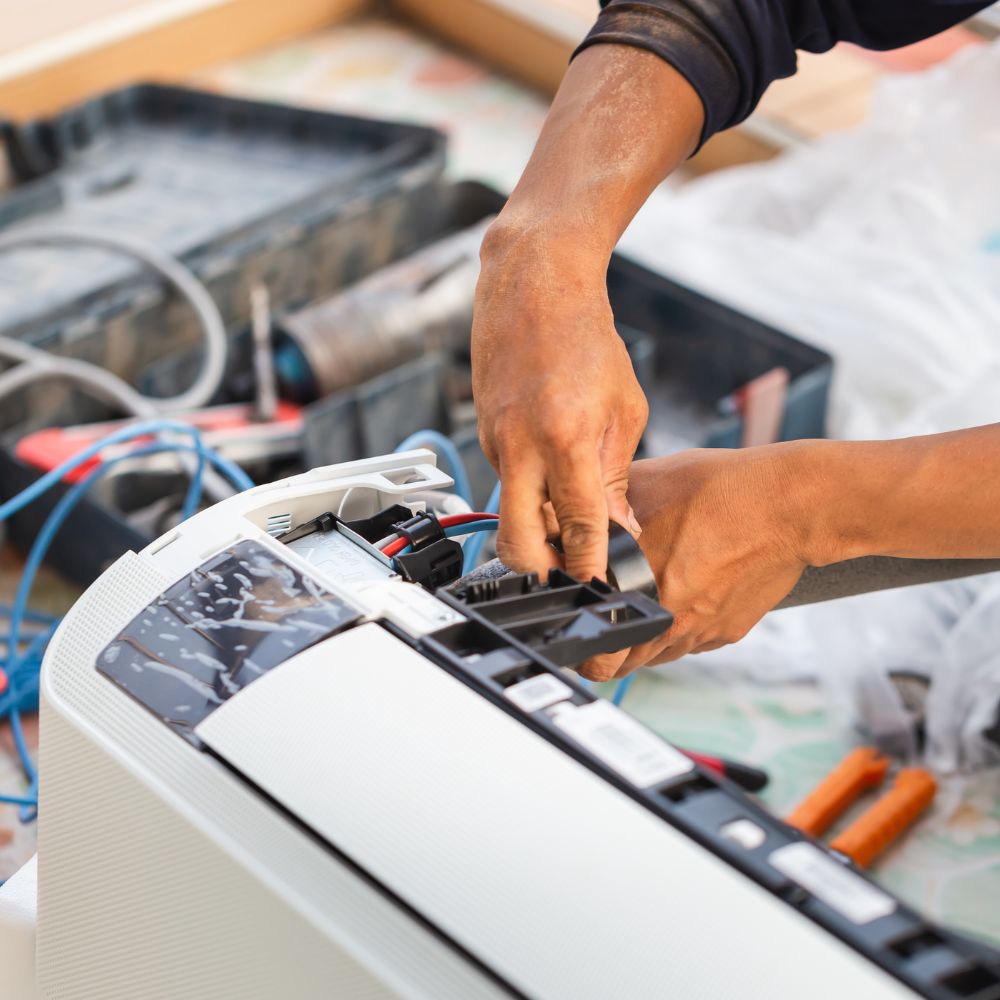Neal HVAC technician servicing a system